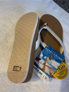 Cobian Women's White Strappy Flip Flop Sandals with Brown Footbed